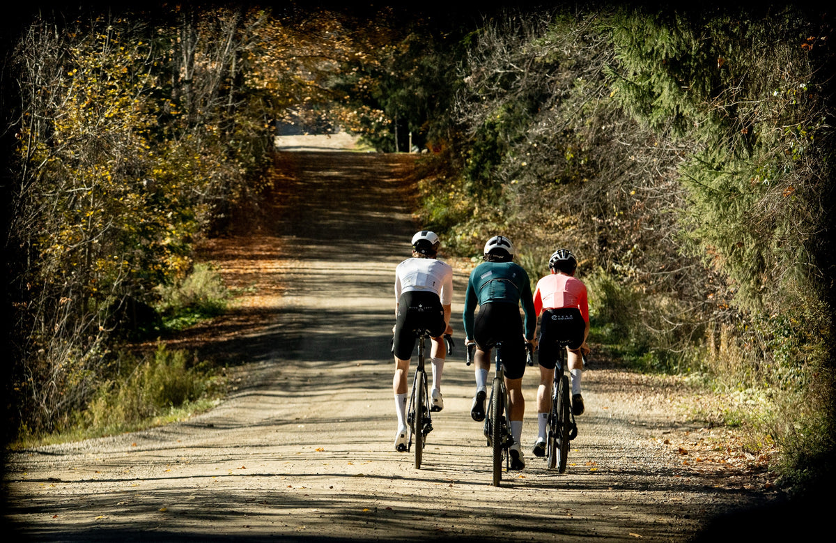 Three riders on Aquila CX-G gravel bikes on a forest road