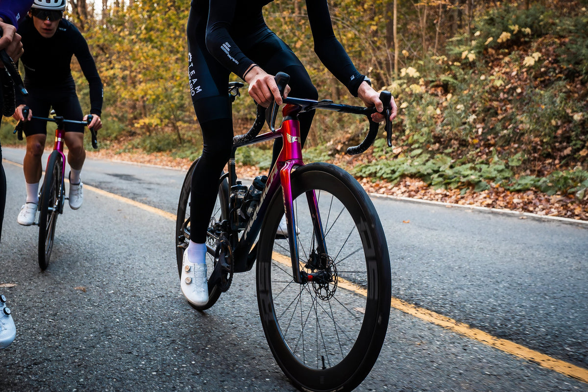 Riders on pink and black Aquila EVO Rs in the fall