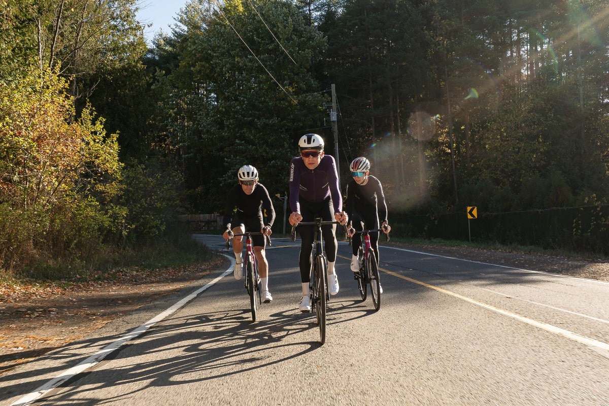 Three riders on Aquila EVO Rs in low sun